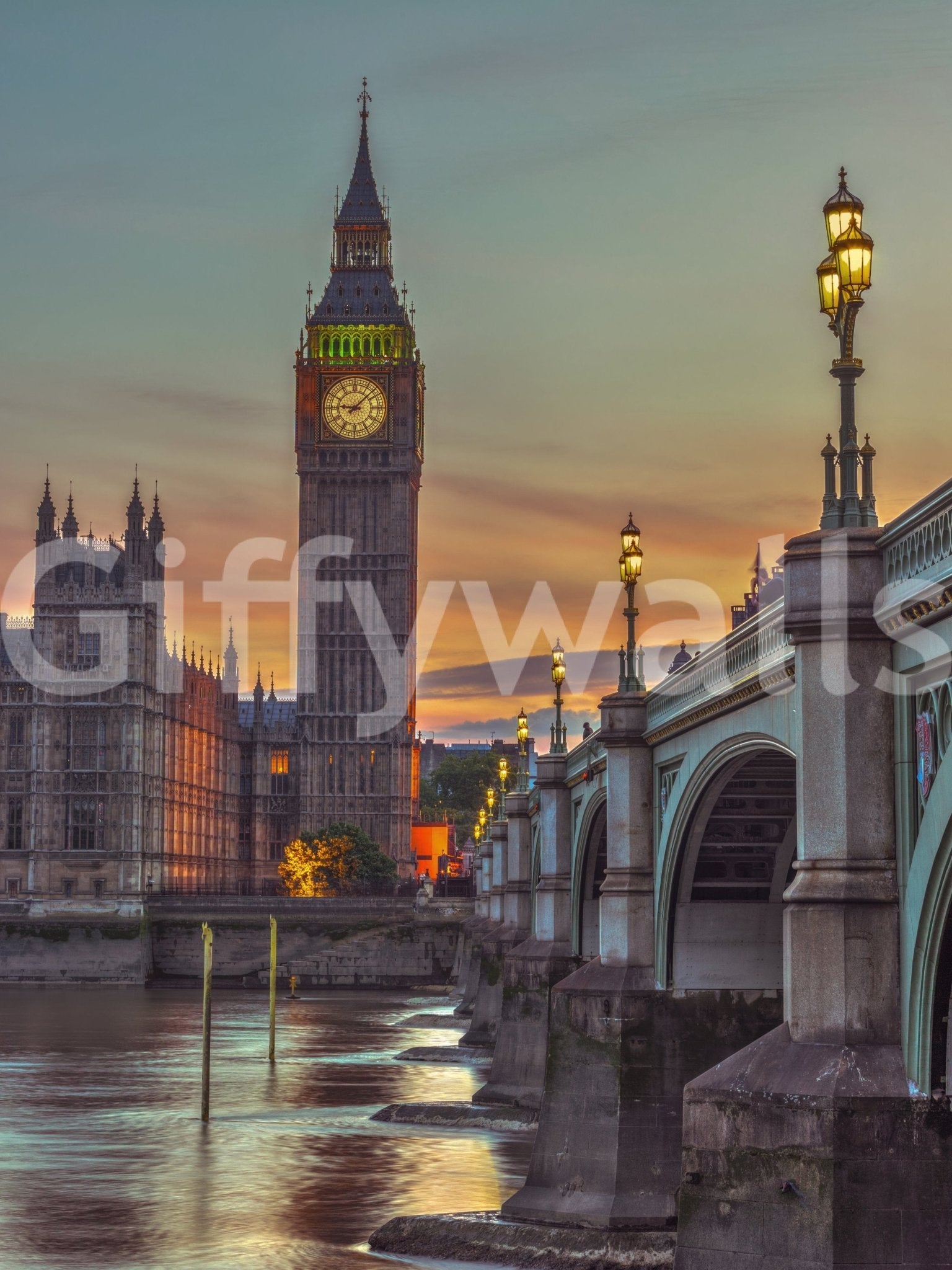 Clock tower wallpaper mural shown full-wall, Big Ben and Westminster Bridge over the Thames at sunset