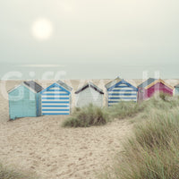 A detail of the warm tones in the beach huts and sky.

