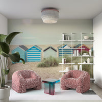 A close-up of the vibrant, painted doors and wooden texture of the sheds.

