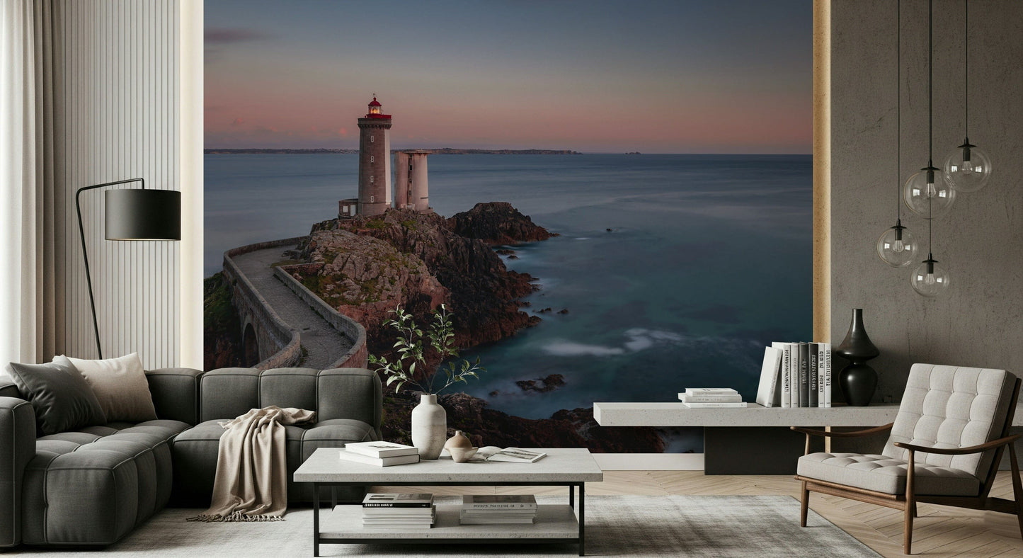 Wall mural depicting a lighthouse by the sea, creating a serene coastal ambiance.
