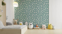 An angled shot of a wall with seashell wallpaper


