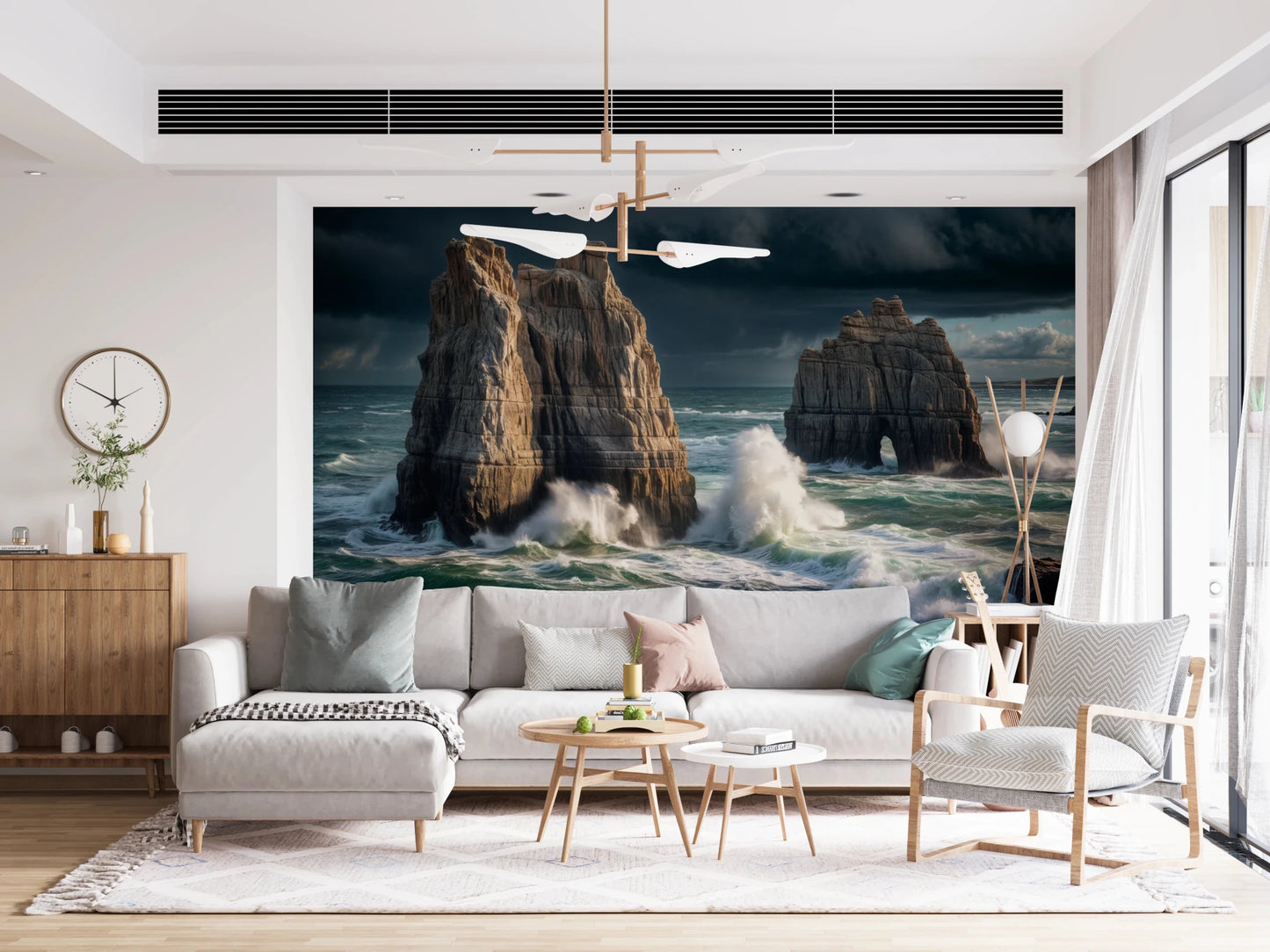 Coastal Giants wallpaper mural behind a large white sectional sofa with colorful pillows in a living room