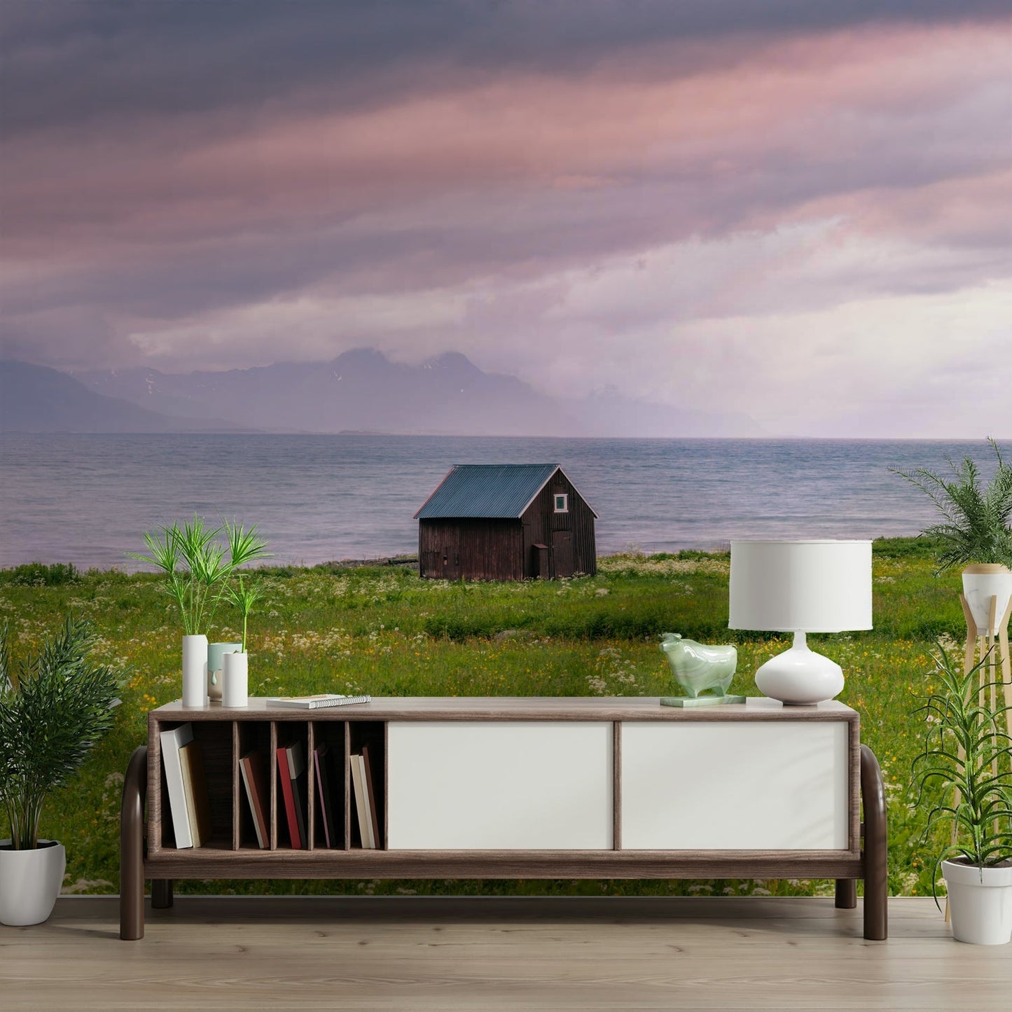 Lush green meadow meeting the tranquil sea under soft skies

