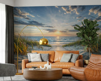 Coastal Path Serenity wall mural of dunes and sea at sunset behind a tan leather sofa and gold arc floor lamp