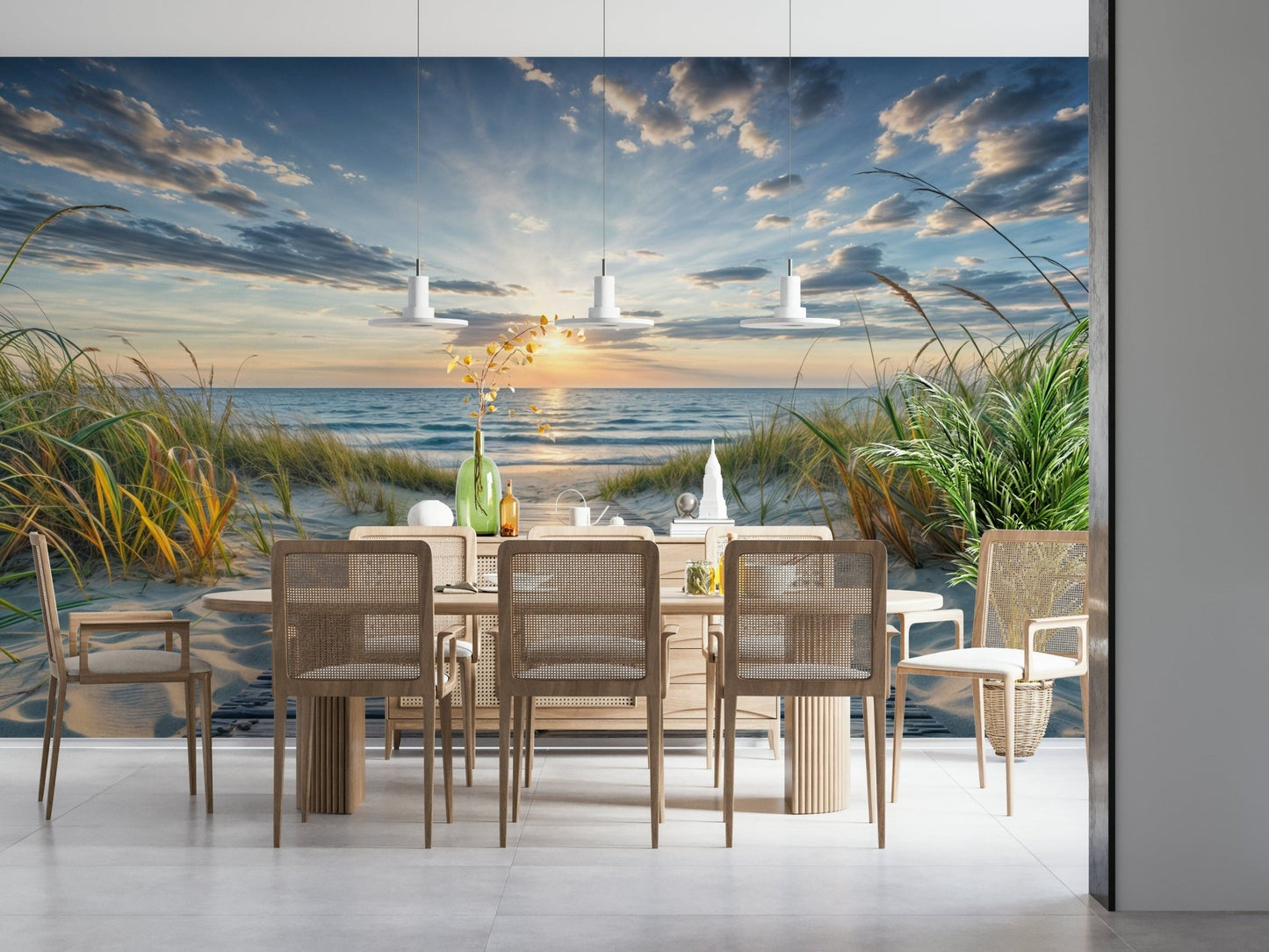 Coastal Path Serenity wall mural of a sunset shoreline behind a light wood dining table with rattan chairs