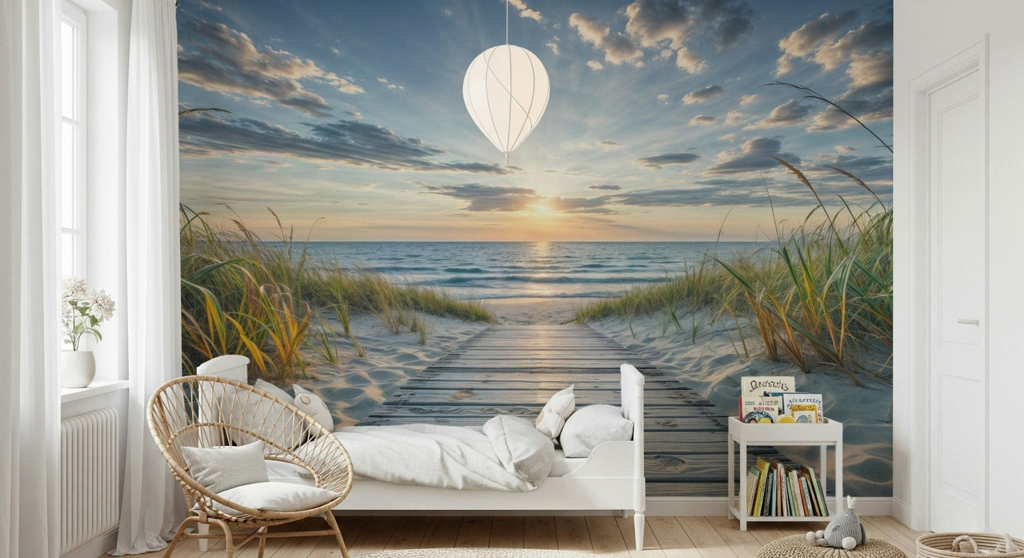 Coastal Path Serenity wall mural of a wooden path to the ocean behind a white bed and balloon pendant in a child's room