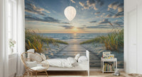 Coastal Path Serenity wall mural of a wooden path to the ocean behind a white bed and balloon pendant in a child's room