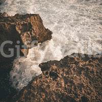A detail of the warm tones in the rock and water.

