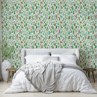 Festive green wallpaper with colorful Christmas trees

