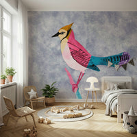 Colorful Jay wall mural of a crested bird on blue above two rattan chairs and wood toys in a kids room