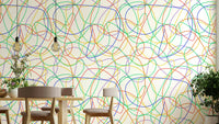 Abstract colorful line print wallpaper on a modern living room feature wall.