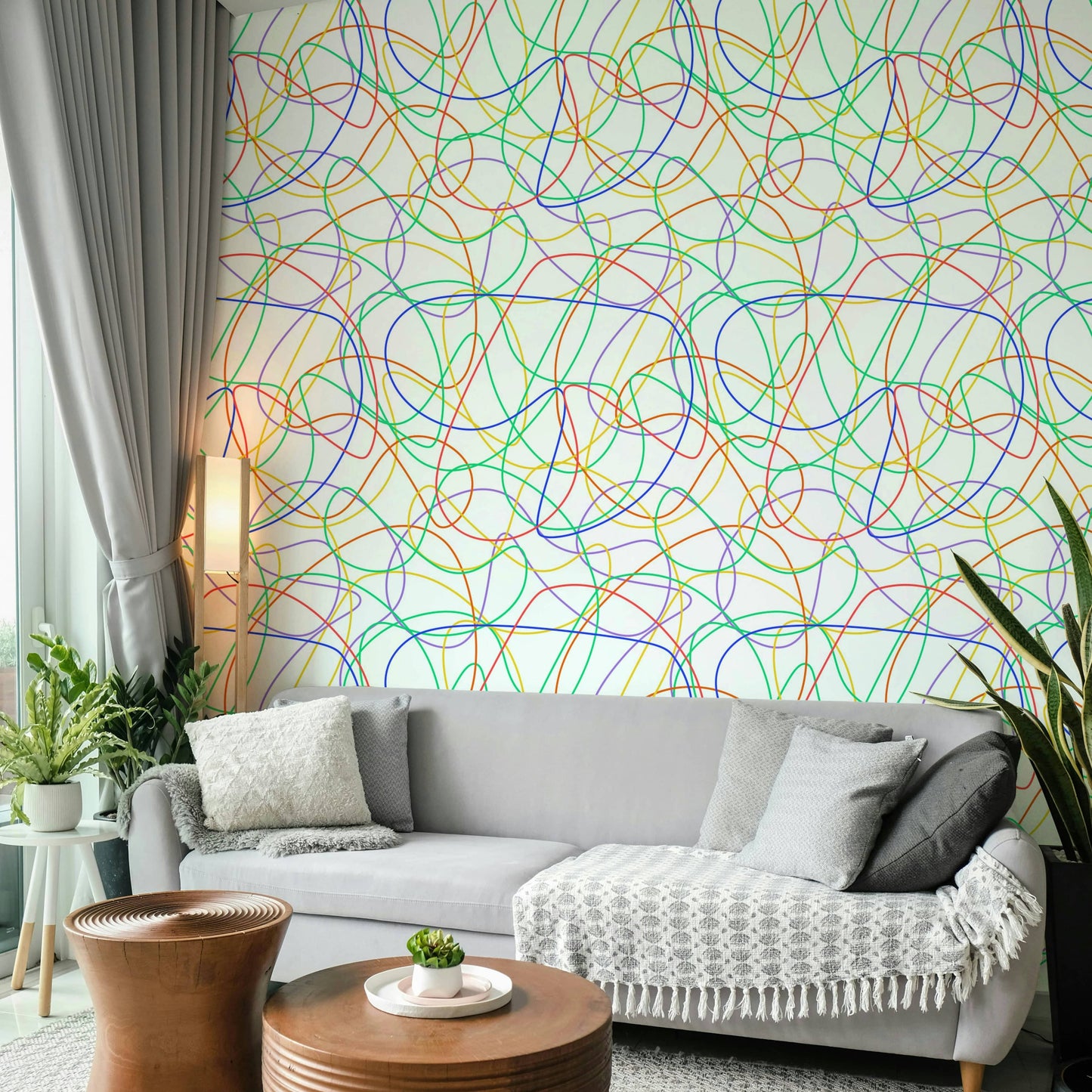 An apartment wall featuring bold multi-color stripes and abstract shapes.