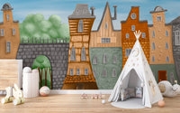 Small Painted City wallpaper mural of tall crooked houses in a kids room with a white star-print play teepee