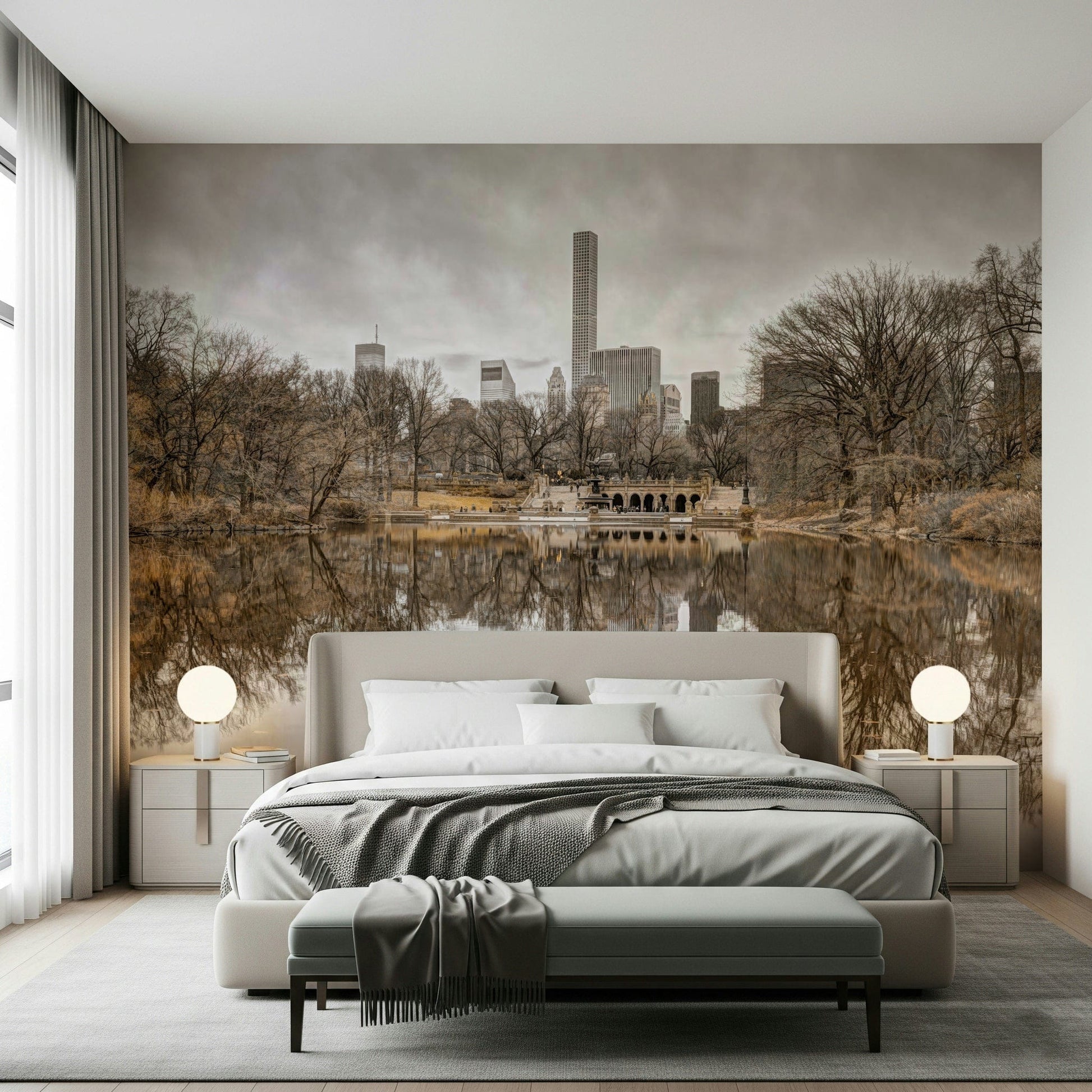 Contrast of Worlds mural over an upholstered bed with two round globe lamps and a bench in a calm bedroom