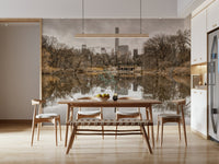 Contrast of Worlds mural behind a wood dining table and bench with a linear pendant in an open kitchen