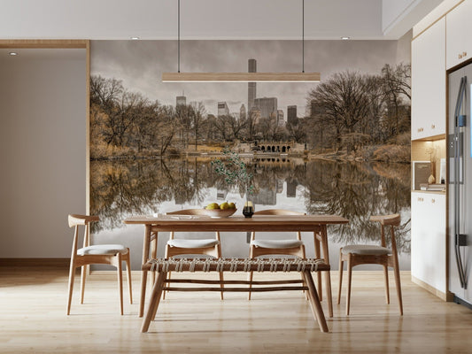Contrast of Worlds mural behind a wood dining table and bench with a linear pendant in an open kitchen