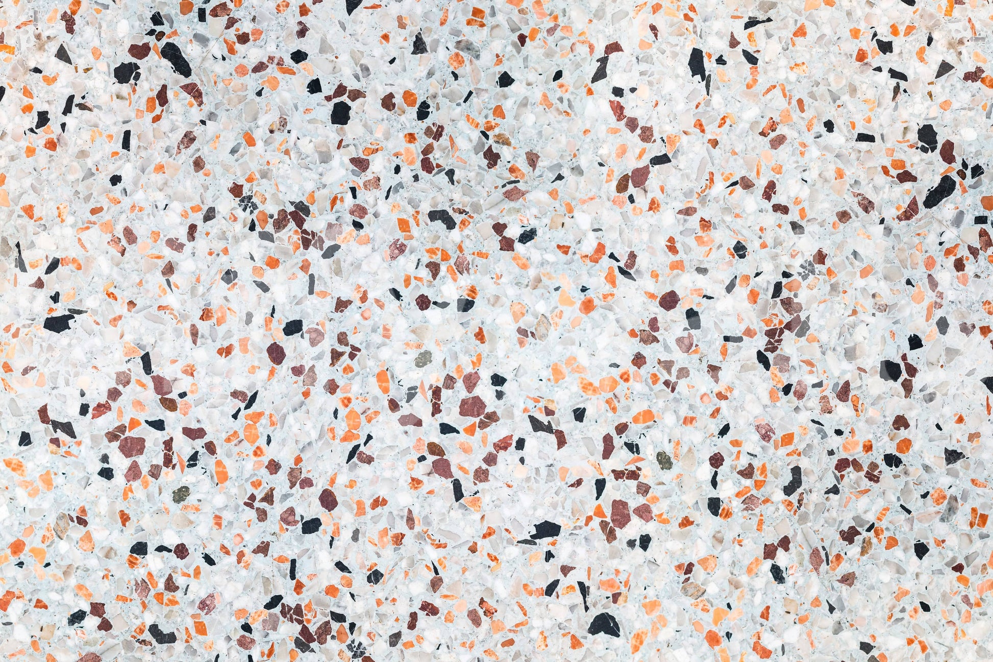 Vibrant Light Coral Terrazzo mural surface abstract composition playful stone particles.