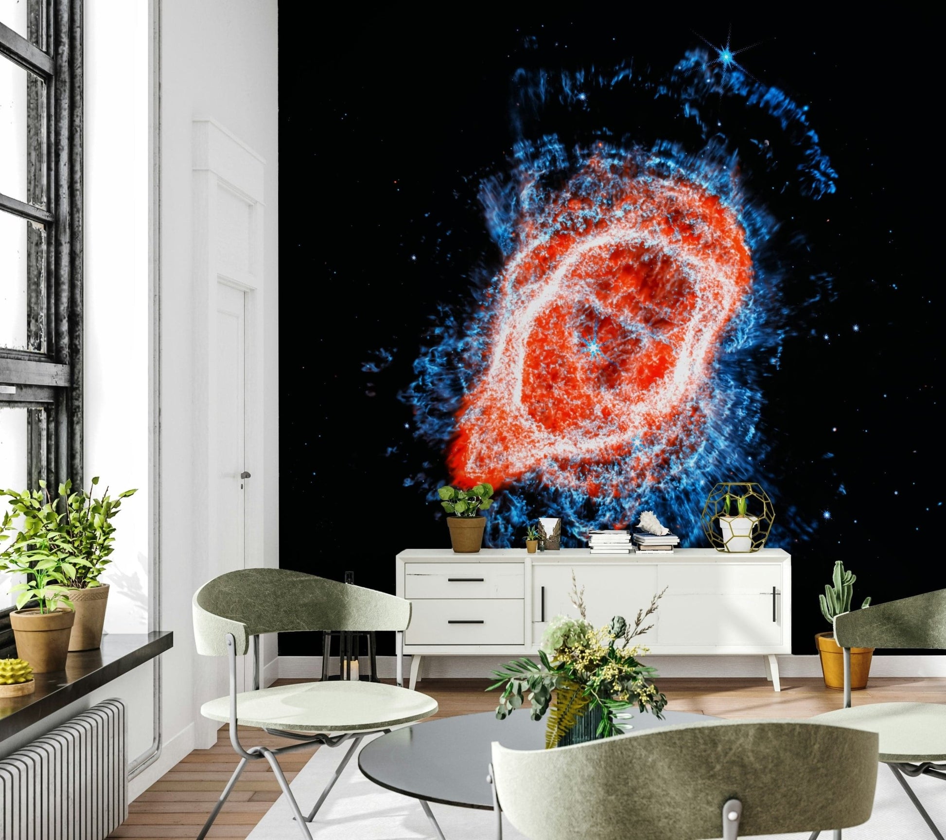 Cosmic Bloom wall mural of a vivid nebula on black behind a white sideboard and green chairs in a dining area