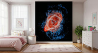 Cosmic Bloom wall mural of a red-orange galaxy on black behind a pink bed with unicorn art in a girls bedroom