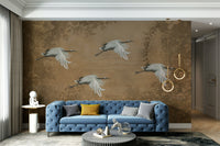 A peaceful wall mural with a design of birds and blossoms.

