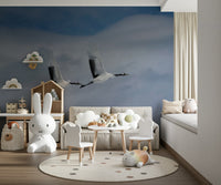 Entryway wall mural showing cranes flying over water, modern wall decor for apartment