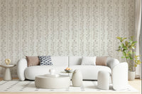 Bohemian aesthetic leaf branch wall mural cream hues.