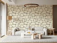 Artistic Pebble Beach wallpaper gray background large stone outlines.