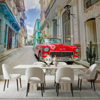 Cuban Classics wallpaper mural of a red vintage car behind a dining table with cream chairs in a dining room