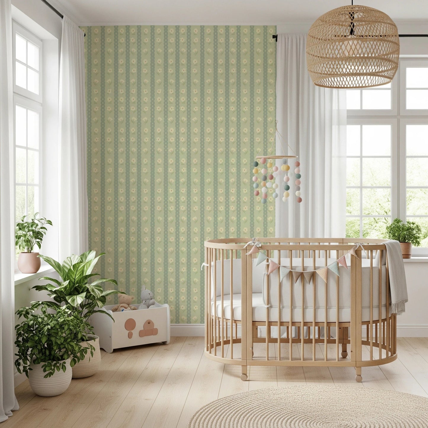 Daisy Chain Delight wallpaper mural in a nursery behind a wood crib with a pompom mobile and leafy plants