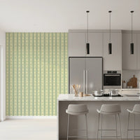 Daisy Chain Delight wallpaper shown as a full-wall mural beside a grey kitchen island with bar stools