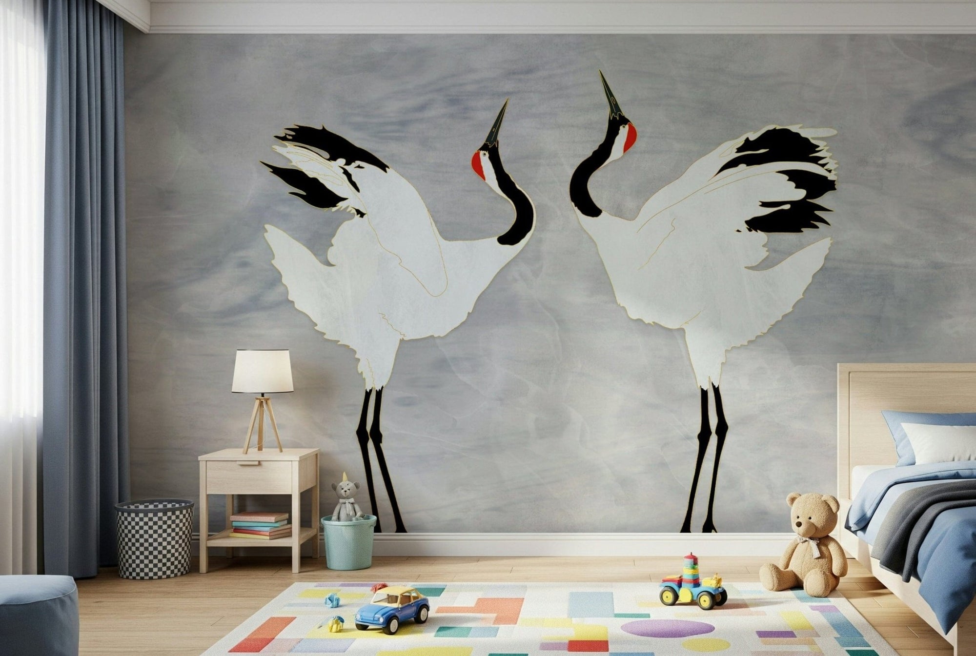 Dancing Cranes wall mural with two red-crowned cranes on grey, above a nightstand and teddy bear in a kids room
