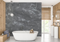 Dark Concrete wallpaper mural styled along a hallway feature wall near a console in black tones