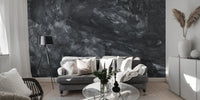 Dark Concrete wallpaper mural styled as a feature wall behind a dining table and chairs in black tones