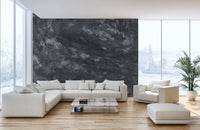 Dark Concrete wallpaper mural as a bedroom feature wall behind the headboard in black tones