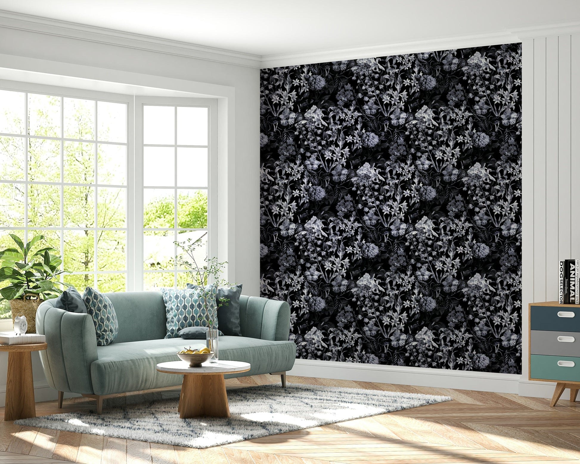 A dining room decorated with a dark floral mural


