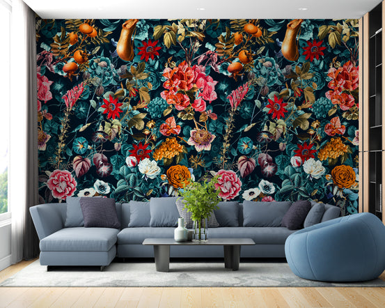 Dark Flower and Leaves Pattern wallpaper in red and teal behind a blue-gray sectional sofa in a living room