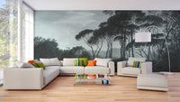 Dark Green Misty Forest Tree wallpaper mural as a feature wall in a home office workspace in green tones