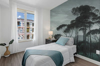 Dark Green Misty Forest Tree wallpaper mural styled as a feature wall behind a dining table and chairs in green tones