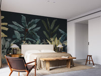 Dark Night Vintage Tropical Tree wallpaper mural styled as a feature wall behind a dining table and chairs in blue tones