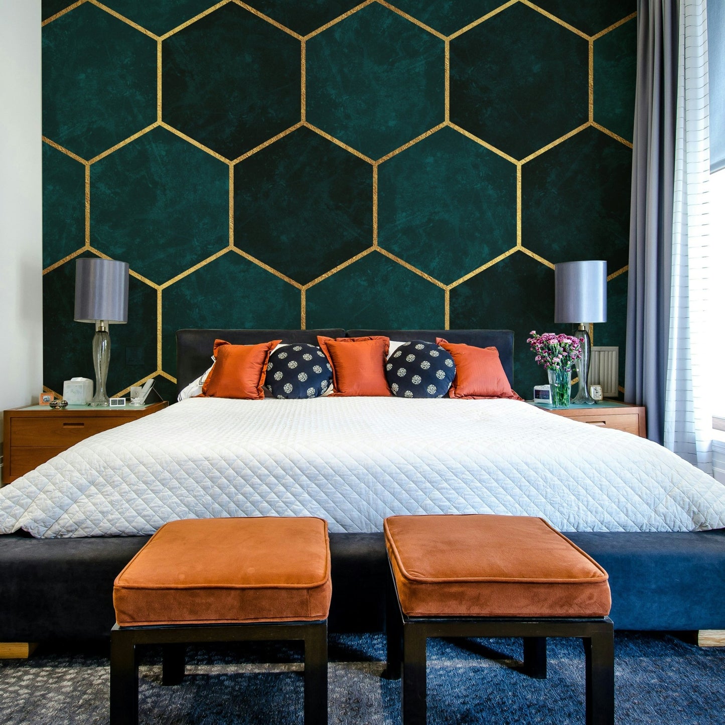 Textured teal mural with bold hexagonal shapes


