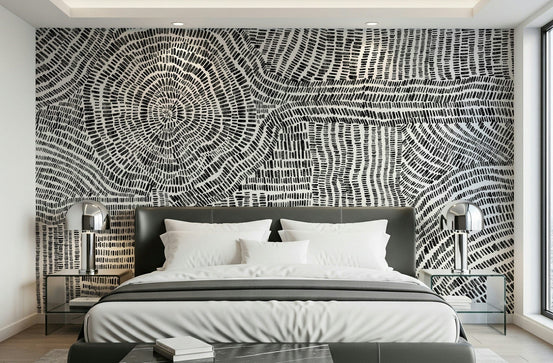 Dash & Dot Maze wallpaper mural in black and white behind a leather headboard bed in a modern bedroom