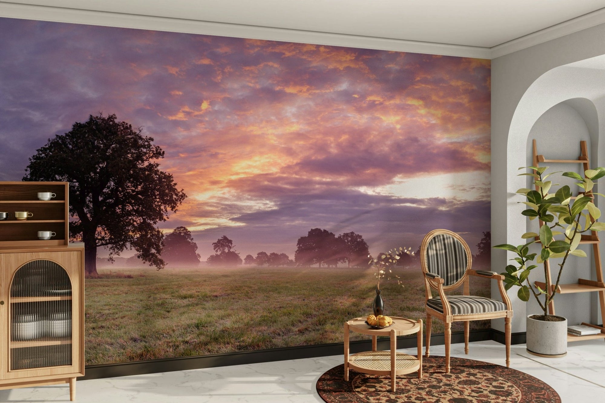 Daybreak Serenity wallpaper mural of a silhouetted tree in a misty field under a purple dawn sky behind a cane armchair in a living room