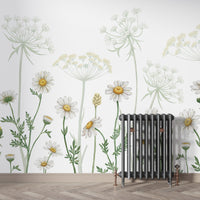 Dazzling Daisies Flower wallpaper of white daisies and wildflowers behind a cast-iron radiator on a full wall