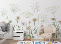 Dazzling Daisies Flower wallpaper of white daisies behind a white bed and beige armchair in a kids room