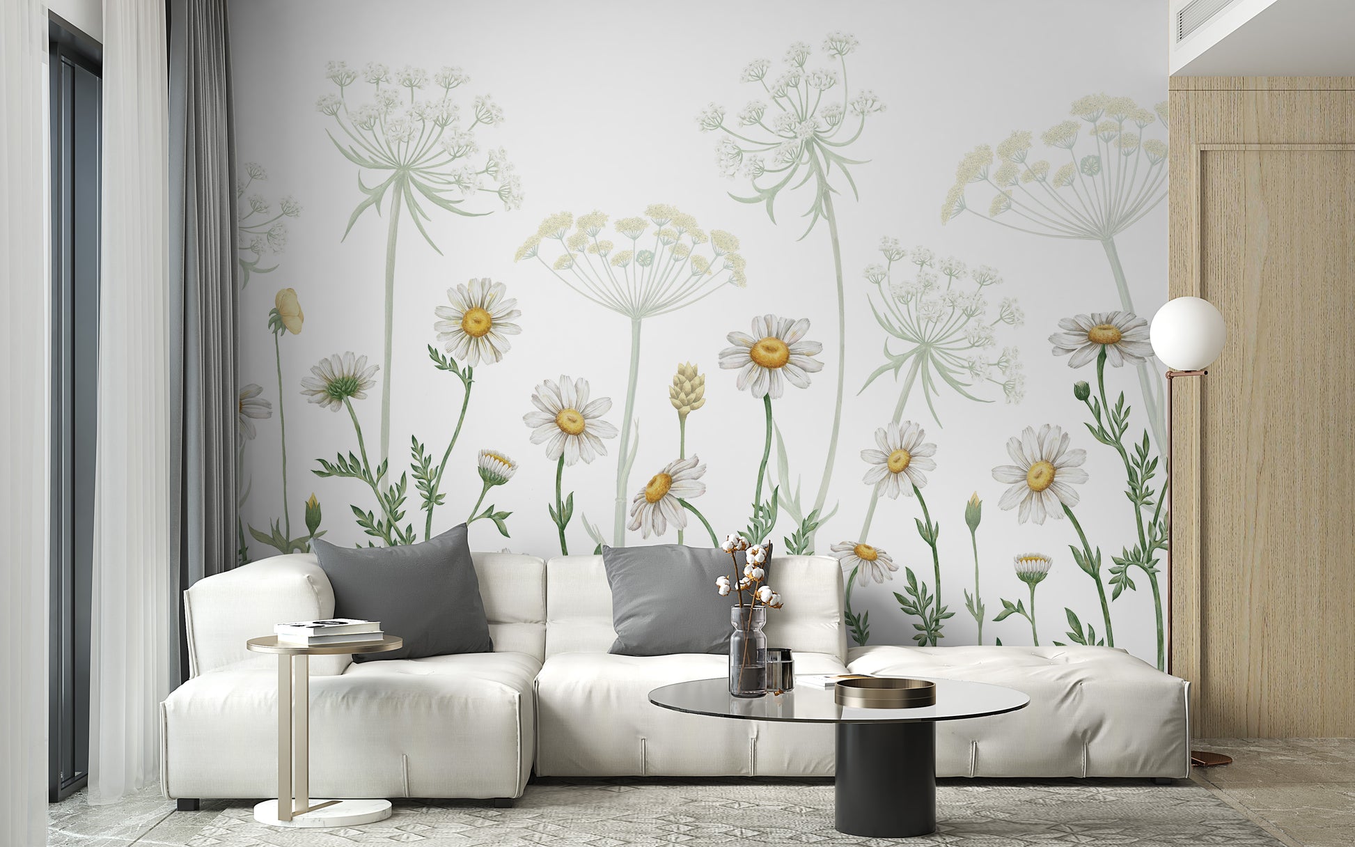 Dazzling Daisies wallpaper of white daisies and wildflowers behind a white sectional sofa in a bright living room