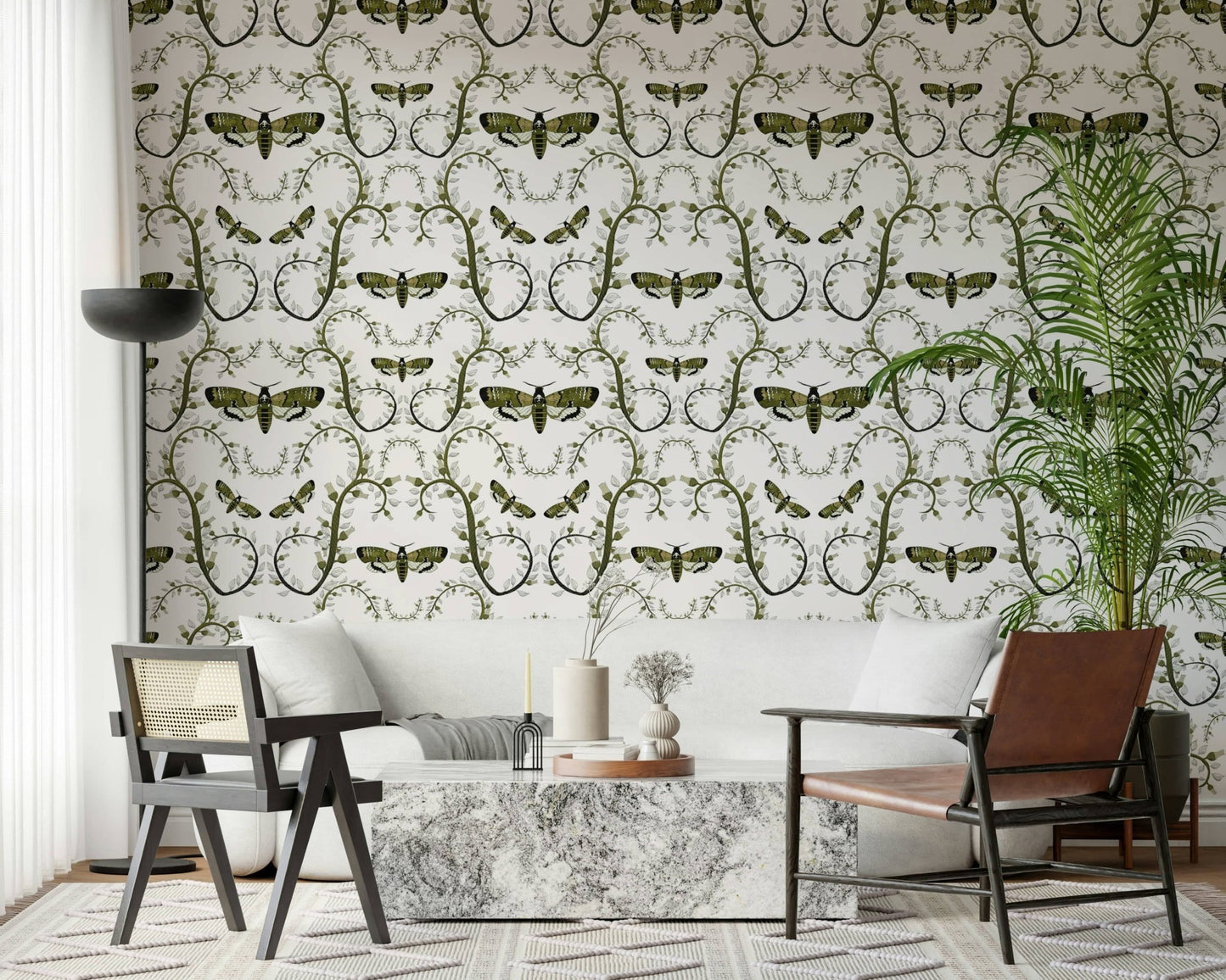 In a lounge, the Death's-Head Hawkmoth Garden Wallpaper reads in green and white.