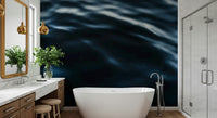 Ocean wave wall mural with rich deep blue gradients and textured water motion.