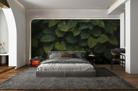 The mural gives the illusion of being surrounded by a wall of plants.
