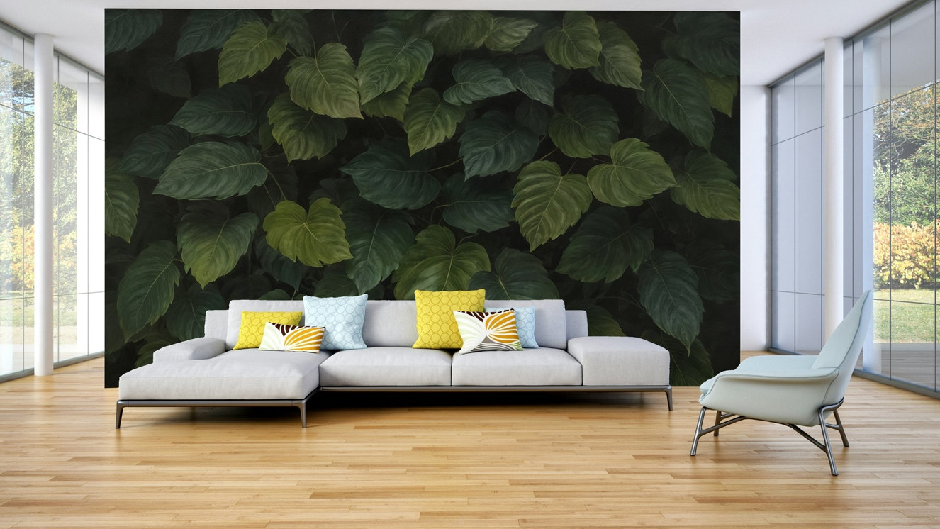 A wall mural depicting a dense wall of various types of green leaves.
