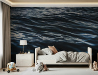 Deep Sea Ripples Wall Mural — flowing water patterns in deep navy and turquoise hues.